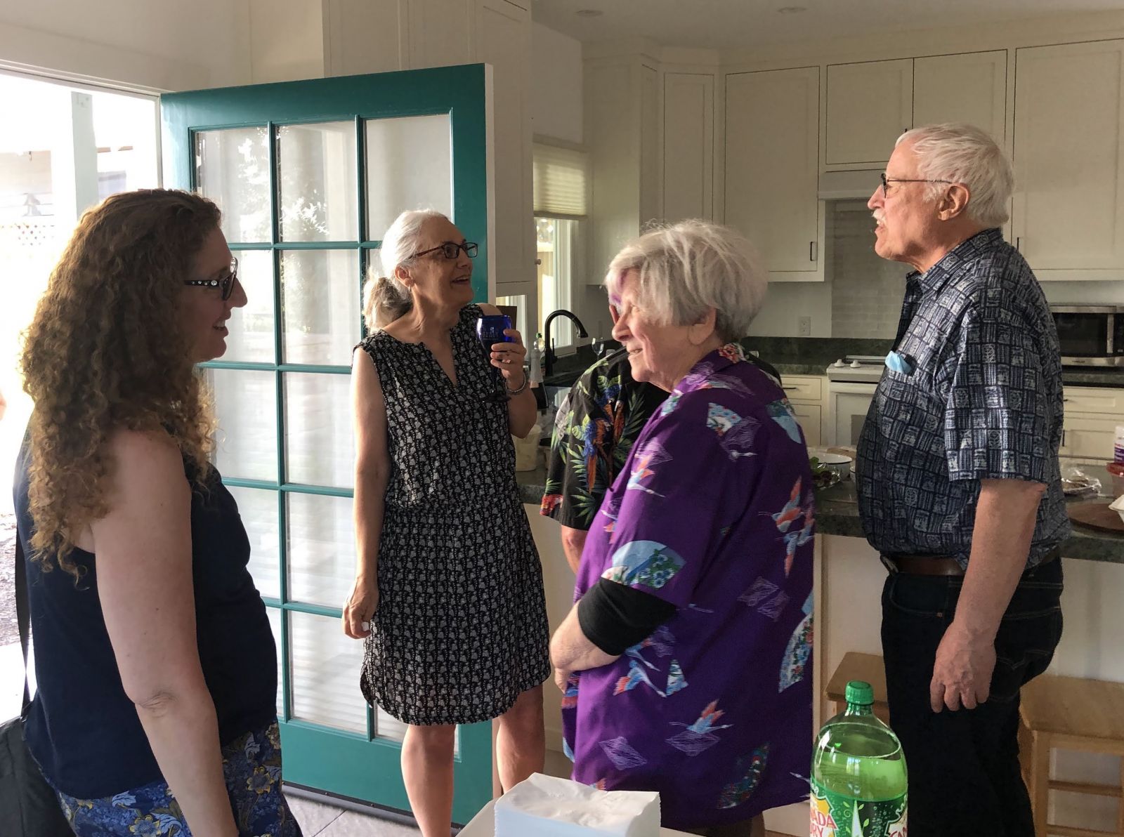 Michelle (in purple) chats with a small group